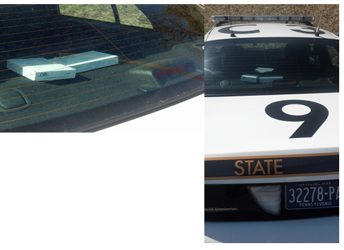 PSP patrol car with blood test kits in the glaring sun